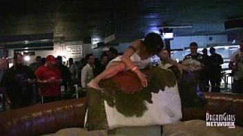 Hot girls in lingerie bull riding at local bar
