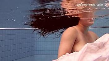Hot russian teenie swims naked in the pool