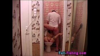 Bathroom fisting teen in stockings