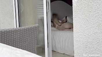 Hot spanish girl was secretly filmed in her hotel room through the window while she was taking some nude photes