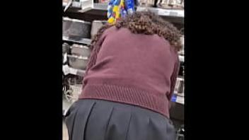 Spying teen girl at supermarket short skirt