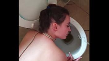 Teen slut gets pissed on with her head in the toilet with face slaps and spit fucked with head in toilet