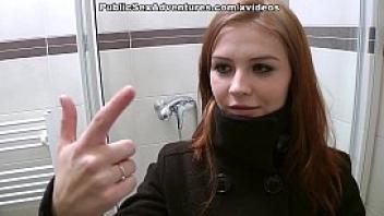 Redhead with innocent face doing perverted stuff in the public toilet