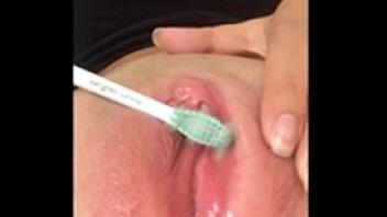 Hot babe has fun with her toothbrush