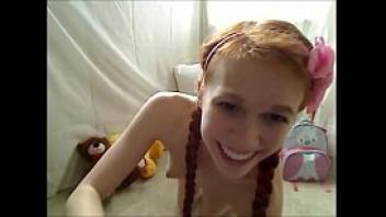 Redhead sex doll masturbates with vibrator