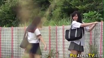 Asian teenagers outdoors urinate