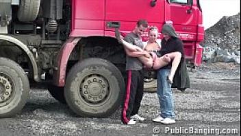 Cute blonde fucked by 2 guys at a public construction site threesome