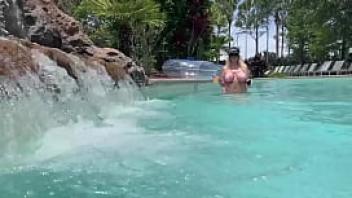 Big tit blonde playing with her pussy at public pool