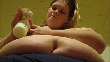 Sexy mom pumps breast milk from her huge milk filled tits