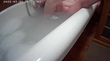 Caught on hidden cam playing in bath