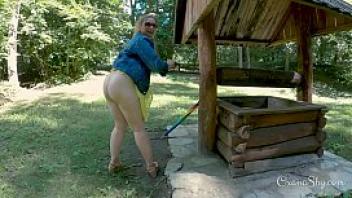 Buttpluged slut in a nature park