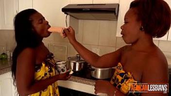 Two black amateur lesbians get naughty in the kitchen