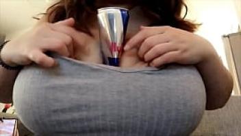 Crushing a red bull can between my massive tits