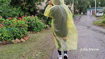 Teen in yellow raincoat flashes pussy outdoors in the rain