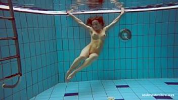 Sexy brunette deniska underwater