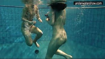 Two sexy amateurs showing their bodies off under water