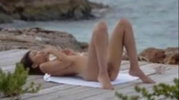 Young asian teen masturbates outside by the ocean masturbating and younger